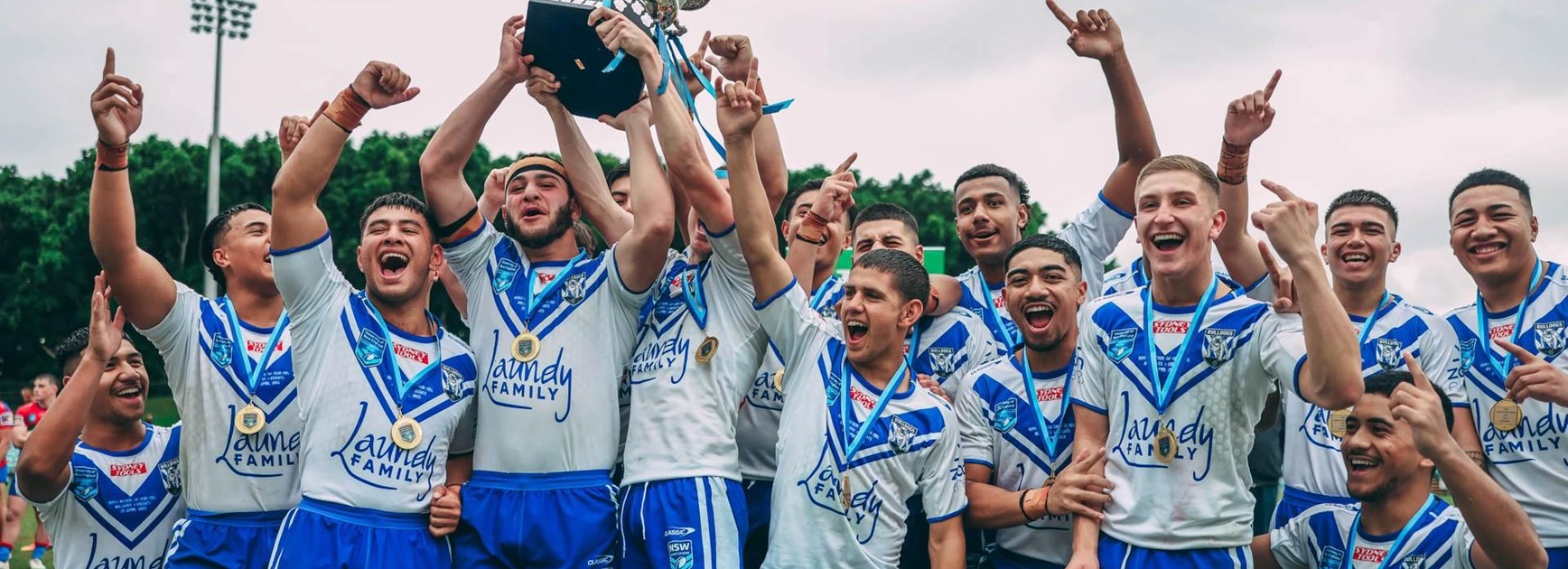 Bulldogs Harold Matthews Cup side celebrate a 32-6 grand final win over the Knights.